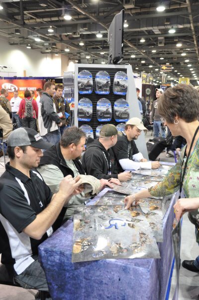 Bone Collector crew signing autographs at the Archery Trade Show in the G5 Outdoors booth.