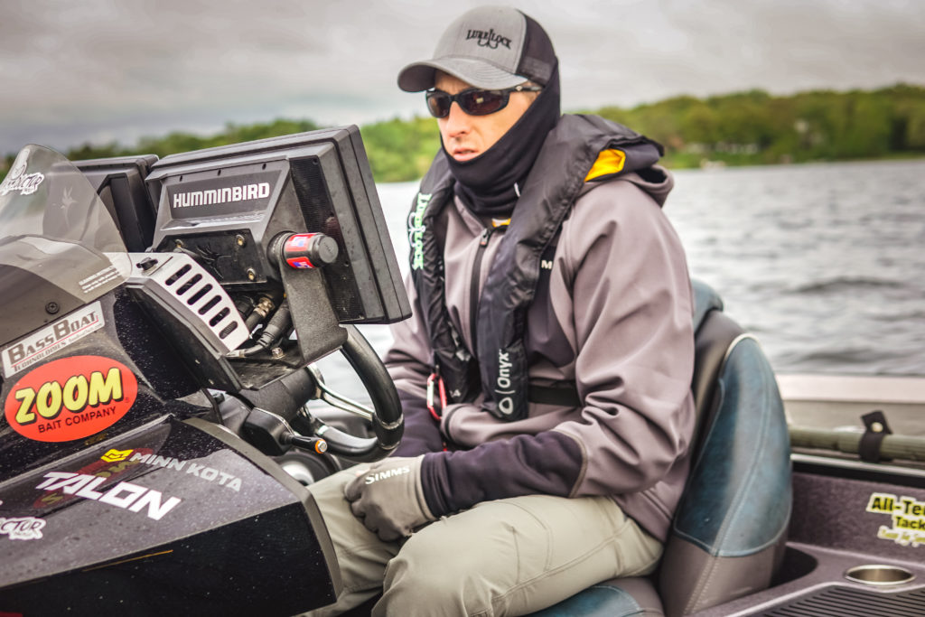 Tournament angler Glenn Walker on the water wearing a Lure Lock branded life jacket.